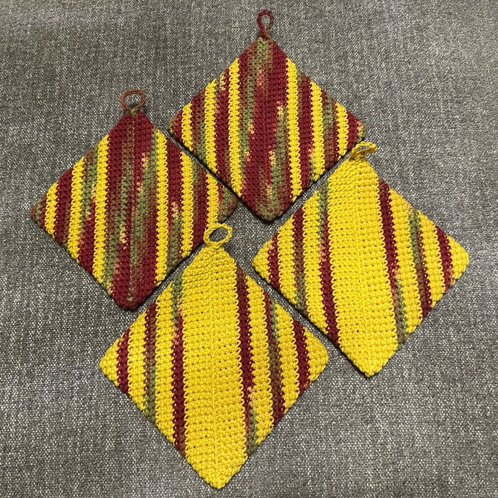 Pot Holders or Hot Pads.  Hand Crocheted 
2 Sets Of 2.
